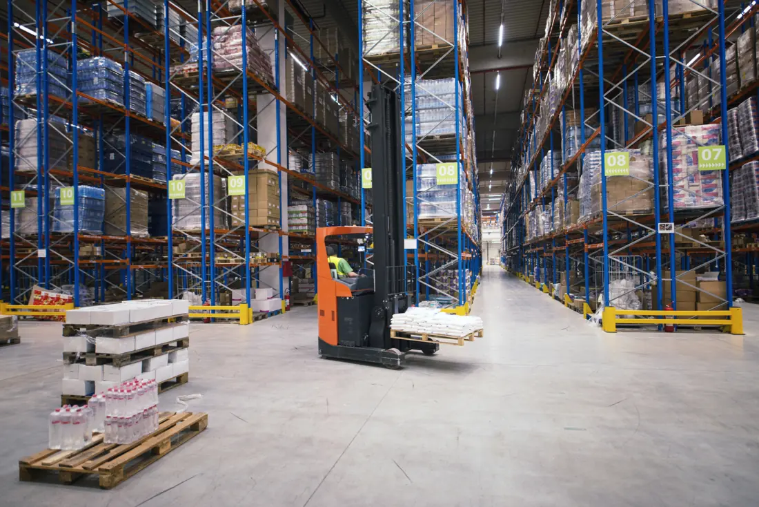 Warehouse with racks and pallets