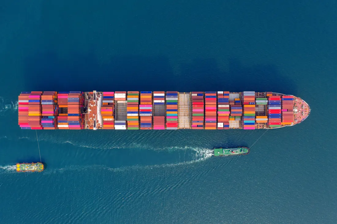 Cargo ship at sea seen from above